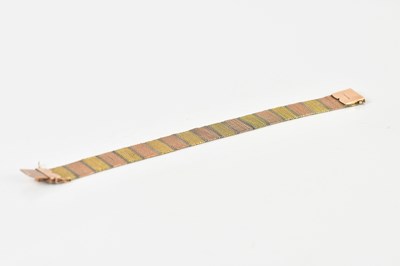 Lot 1571 - A 9ct three tone gold mesh bracelet, length...