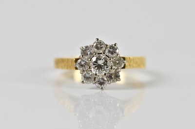 Lot 77 - An 18ct yellow gold diamond floral cluster...