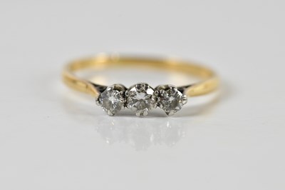 Lot 1363 - An 18ct yellow gold three stone diamond ring,...