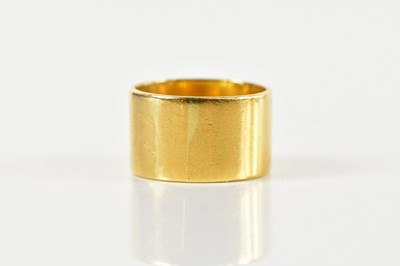 Lot 1435 - A broad 18ct yellow gold wedding band, size P,...