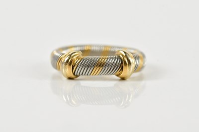 Lot 1305 - CARTIER; a two tone ribbed ring, with yellow...