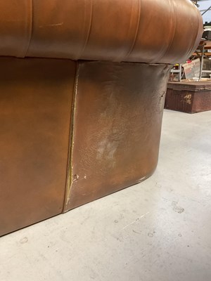 Lot 51 - A brown leather Chesterfield three-seater...