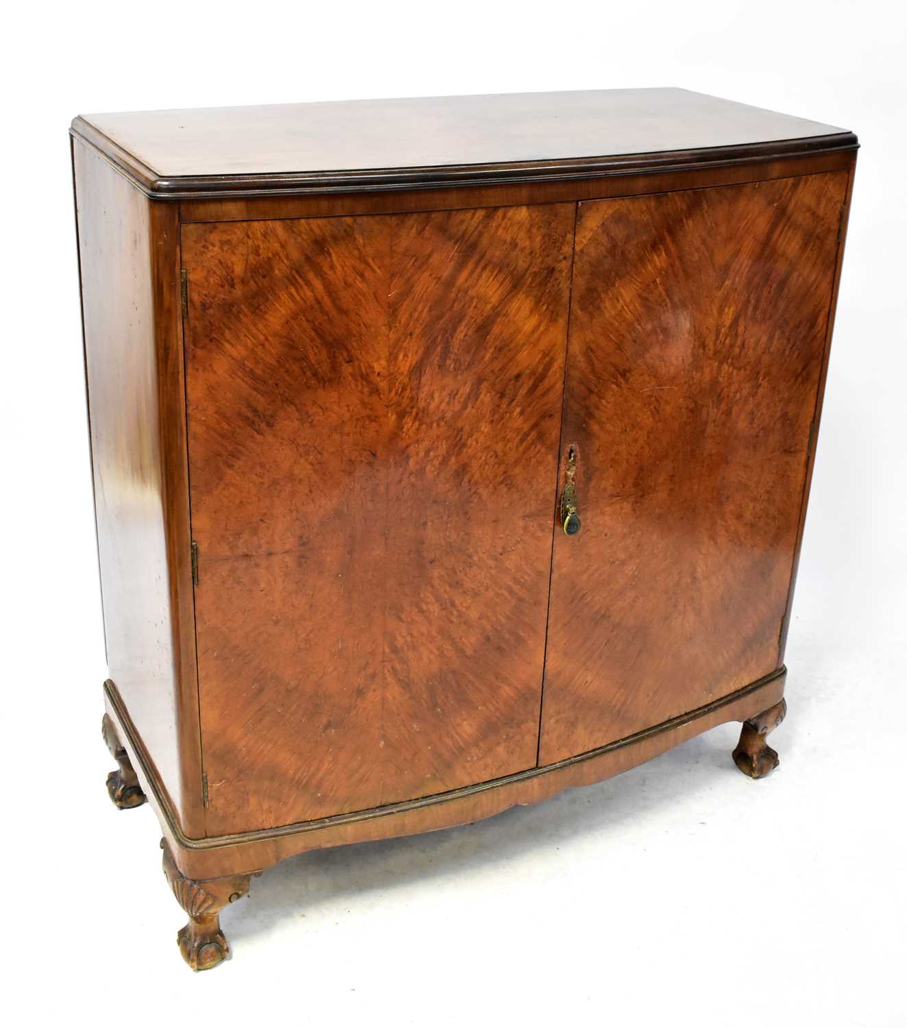 Lot 8 - An early 20th century walnut bow-fronted...