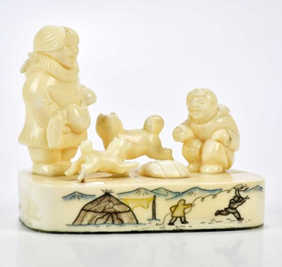 Lot 2577 - A modern whale tooth carved Inuit sculpture...