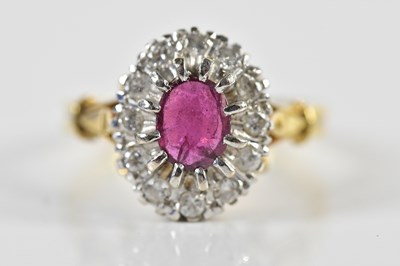 Lot 1359 - An 18ct yellow gold diamond and ruby oval...