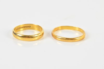 Lot 1360 - Two 22ct yellow gold wedding bands, one af,...