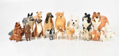 Lot 2735 - BESWICK; a collection of model dogs including...