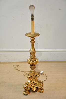 Lot 1303 - A decorative gilt table lamp with moulded...