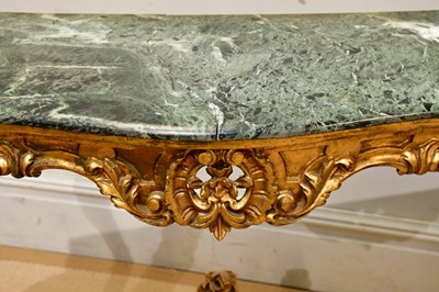 Lot 38 - A gilt wood serpentine fronted marble top...