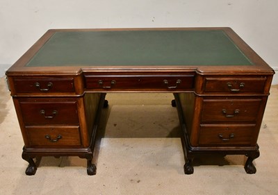 Lot 2141 - A mahogany inverted breakfront kneehole desk,...