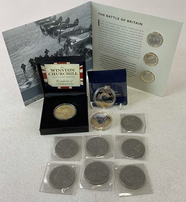 Lot 1365 - A group of coins including a gold plated...