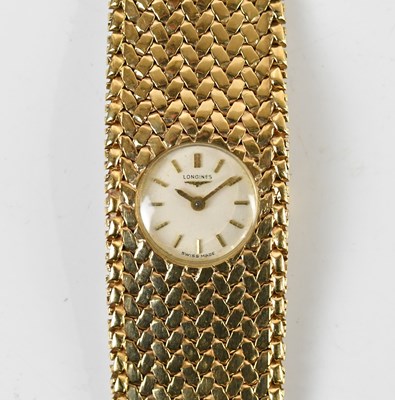 Lot 1828 - LONGINES; a lady's 9ct yellow gold wristwatch,...