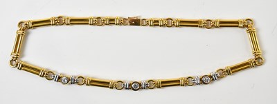 Lot 1585 - A yellow and white metal diamond set necklace...