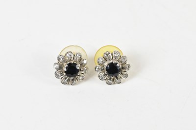 Lot 1671 - A pair of yellow and white metal sapphire and...