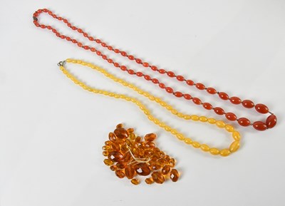 Lot 460 - A long graduated peach coloured hand tied...