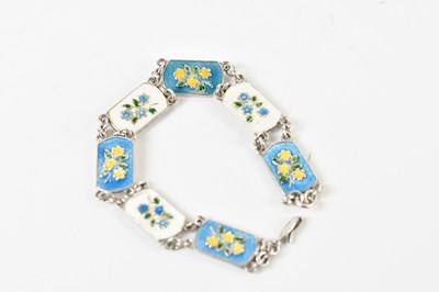Lot 1582 - A silver and enamel floral decorated panel...