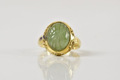 Lot 1433 - A Chinese 14ct yellow gold and carved jade...