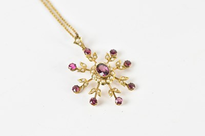 Lot 1635 - An Edwardian 9ct yellow gold pink sapphire and...
