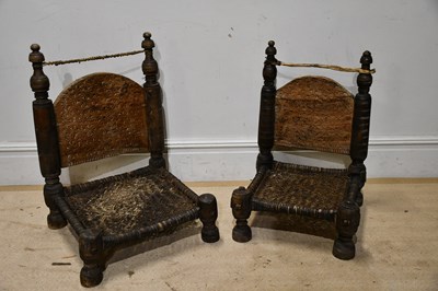 Lot 1324 - A pair of low Afghan chairs, height 75cm.