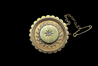 Lot 1174 - A Victorian yellow metal diamond set circular...