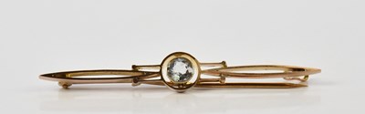 Lot 275 - A 9ct rose gold and pale aquamarine bar brooch,...