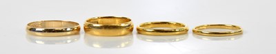 Lot 94 - Two 22ct yellow gold wedding bands, sizes O...