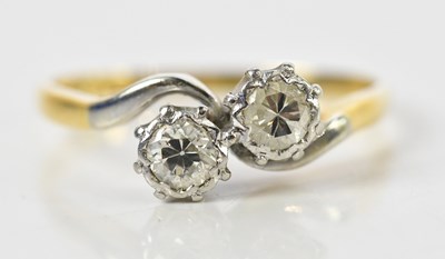 Lot 133 - An 18ct yellow gold platinum tipped two stone...