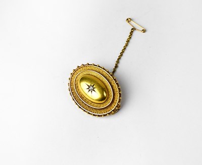 Lot 1145 - A Victorian yellow metal oval mourning brooch...