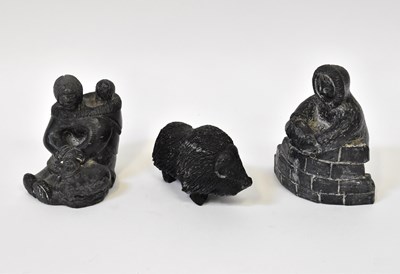 Lot 586 - A group of three Inuit sculptures comprising a...