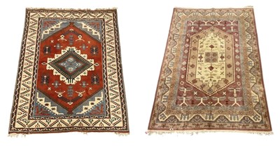 Lot 57 - Two Persian red ground carpets with geometric...
