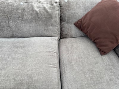 Lot 25 - A modern grey upholstered grey L-shaped corner...