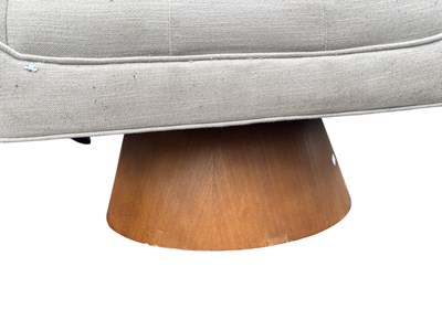 Lot 29 - A contemporary swivel lounge chair upholstered...