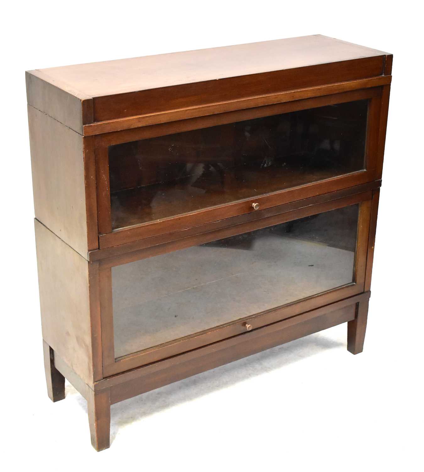 Lot 5 - GLOBE-WERNICKE; a mahogany two-section...