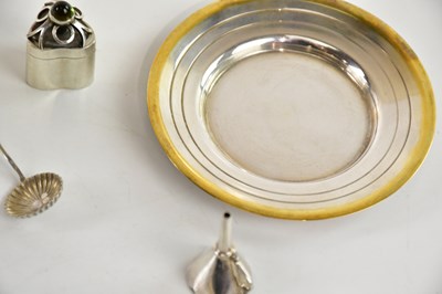 Lot 87 - A contemporary white and yellow metal cup and...