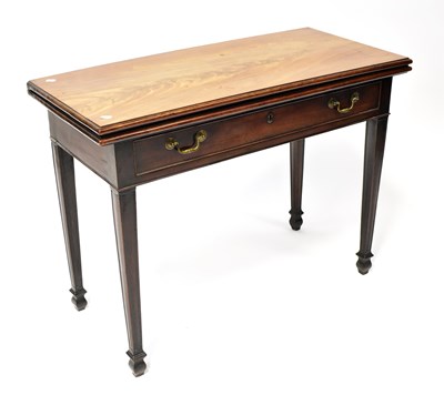 Lot 39 - A 19th century mahogany fold-over tea table...