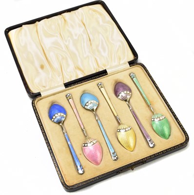 Lot 1101 - TREVITTS & SONS; a cased set of six of silver and coloured enamel coffee spoons