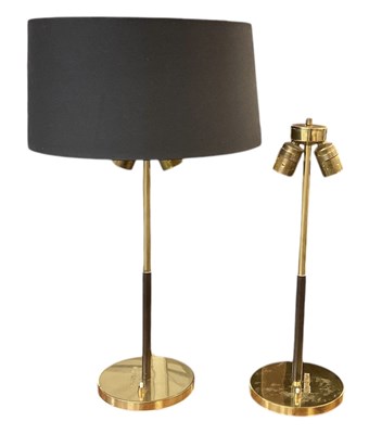 Lot 67 - A pair of modern brass and leather clad two...