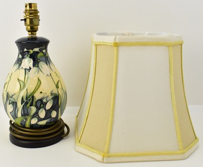 Lot 68 - MOORCROFT; a 'Nivalis Snowdrops' pattern table...