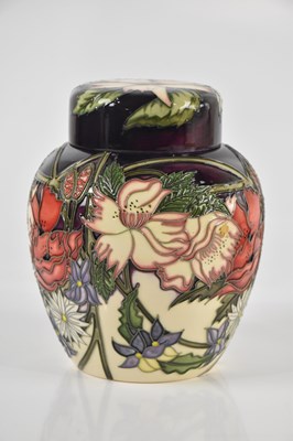 Lot 1412 - MOORCROFT; a ginger jar and cover decorated...