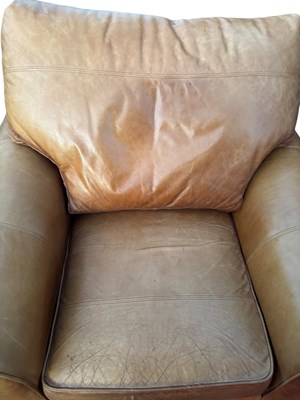 Lot 41 - A tan leather arm chair, height 80cm, depth...