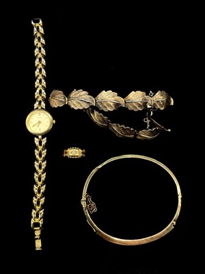 Lot 1268 - An 18ct yellow gold diamond and ruby three...