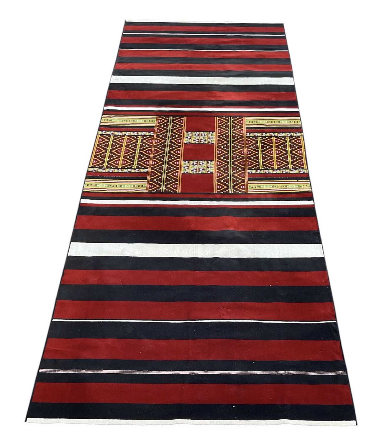Lot 59 - A modern Turkish Kilim style carpet with black,...