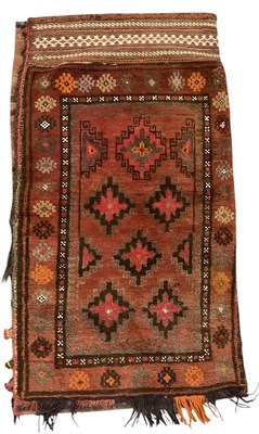 Lot 62 - A Persian Balesht red ground carpet bag, with...