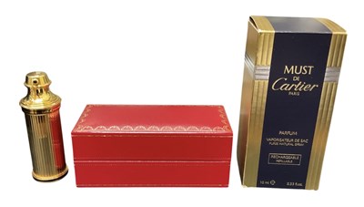 Lot 476 - MUST DE CARTIER; a refillable purse natural...