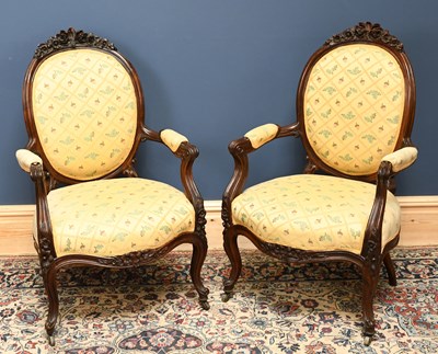 Lot 2728 - A pair of French carved and stained walnut...