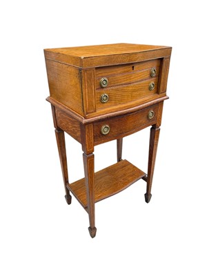 Lot 729 - An early 20th century oak serpentine fronted...
