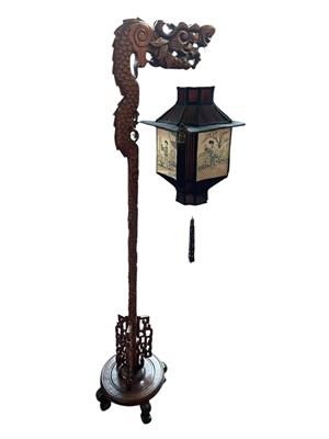 Lot 1350 - An early 20th century Chinese carved standard...