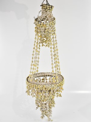 Lot 1310 - A vintage shell candle holder.