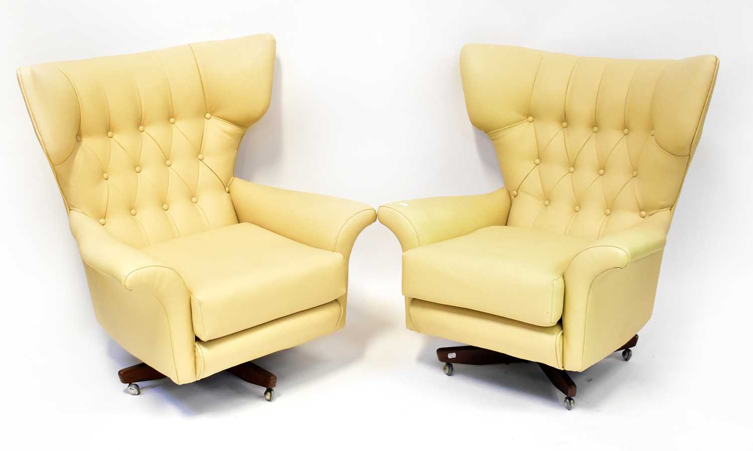Lot 6 - G-PLAN; a pair of Blofeld-style cream leather...