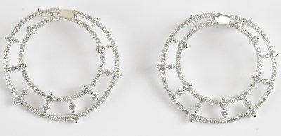 Lot 1384 - A pair of 18ct white gold diamond openwork...